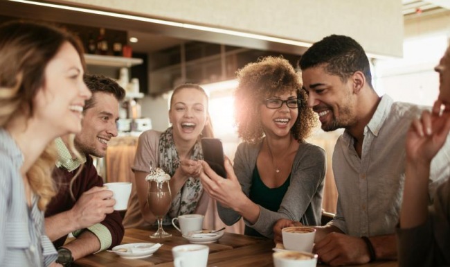 a group of people sitting around a table